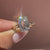 Nature inspired emerald diamond ring design.
