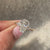 Coffin cut seven stone ring with round side stones.