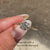 Minimal round cut diamond ring with four claw prong setting.
