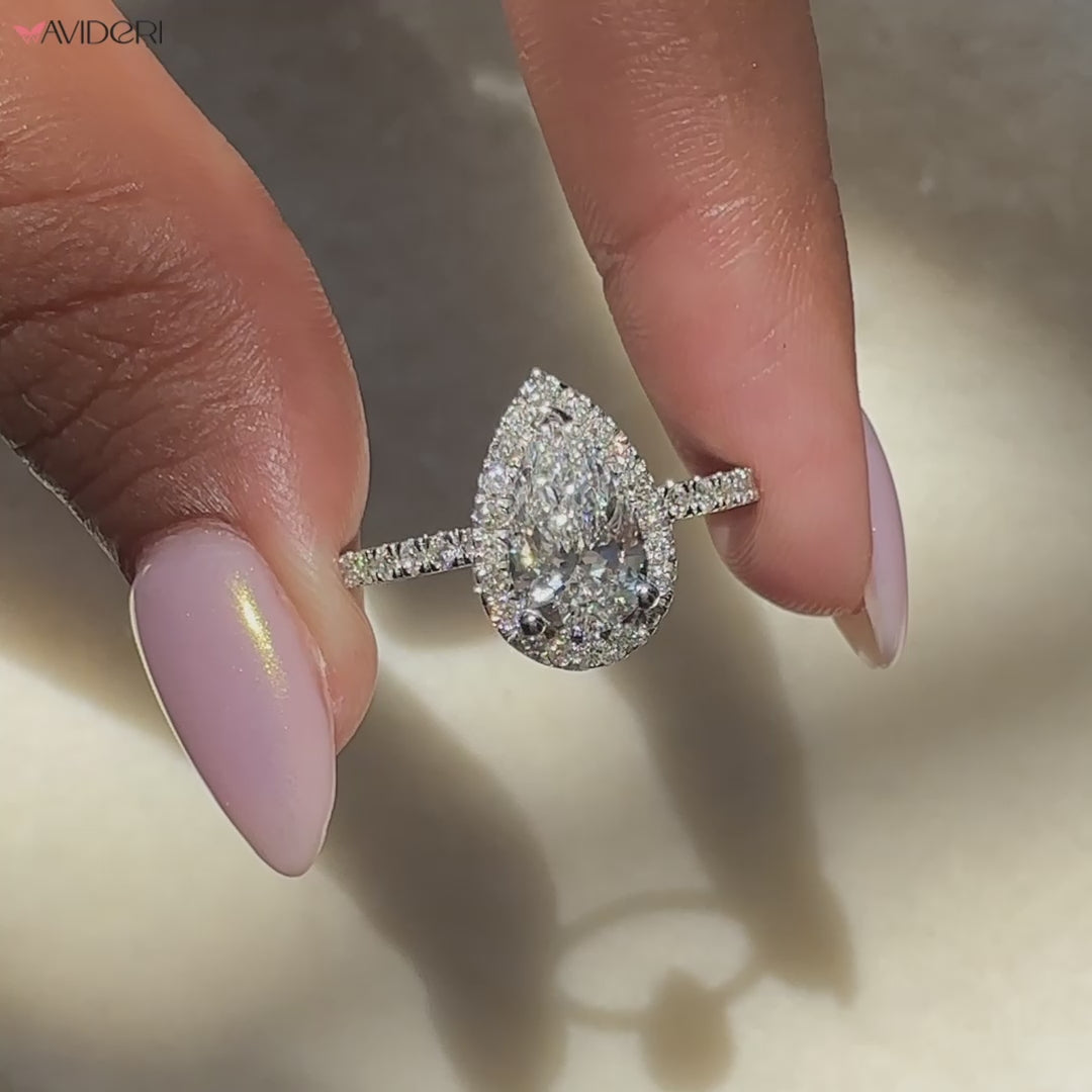 Lab grown diamond ring with pave and V prong setting.