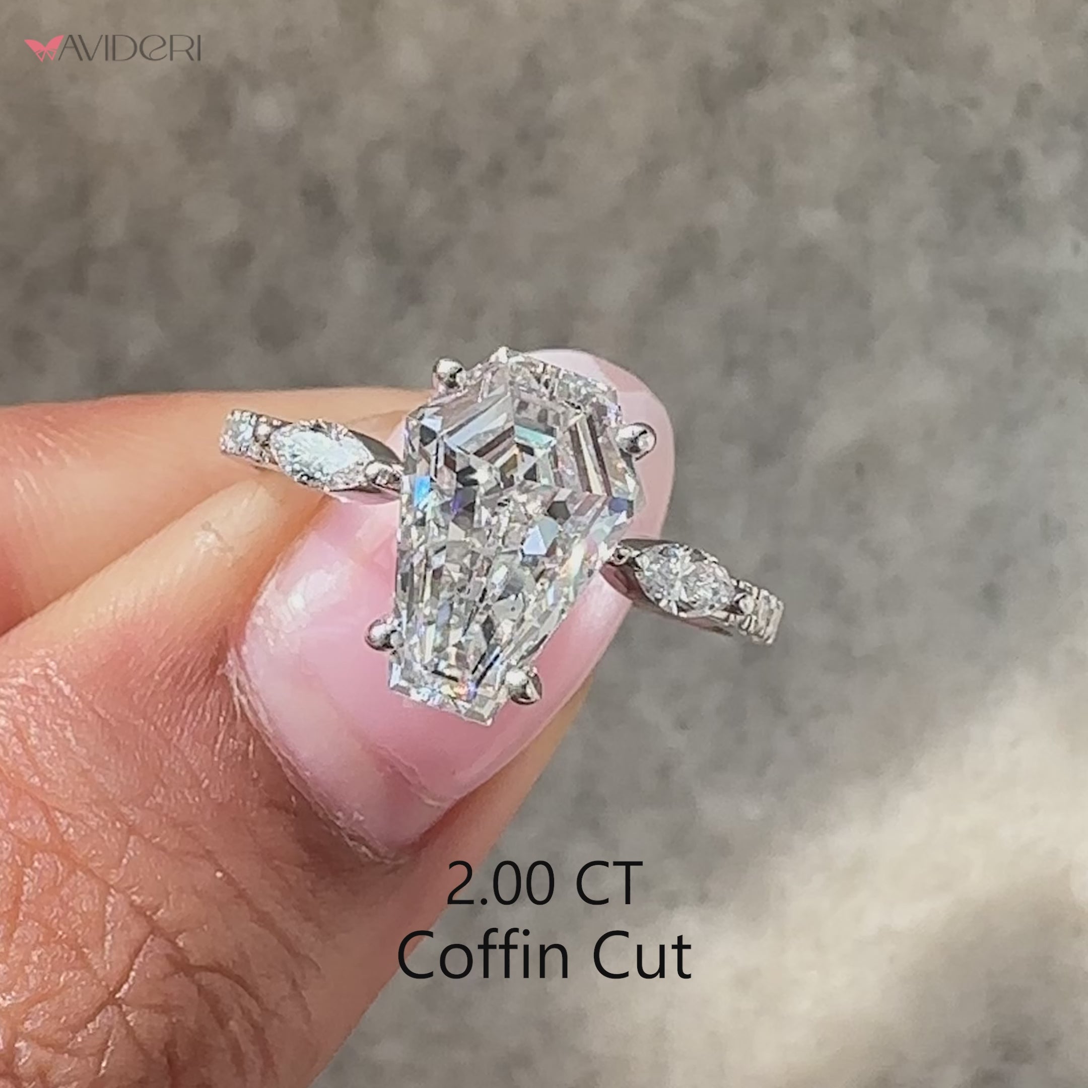 Coffin cut IGI certified diamond ring with side stones.