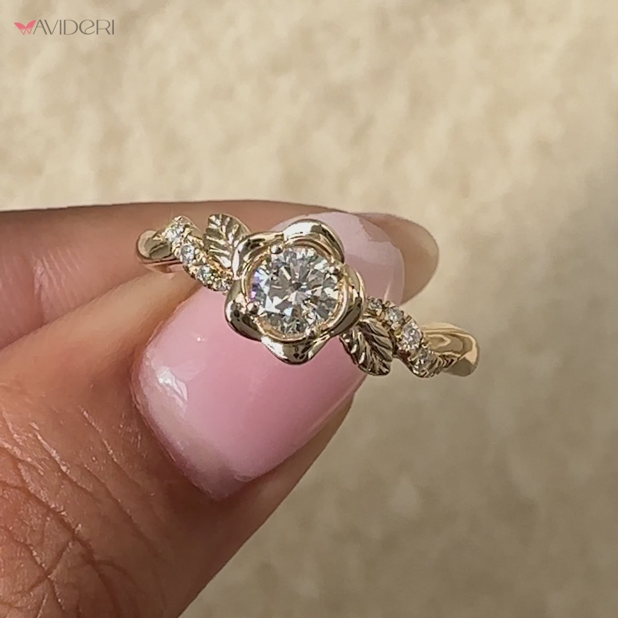 Statement engagement ring with a round diamond and nature-inspired design.