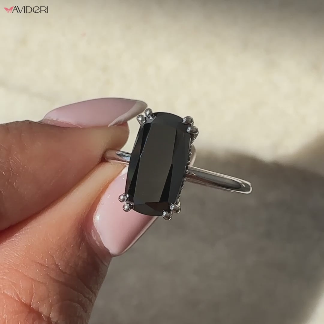 Black moissanite ring shines with a bold and unique center stone.
