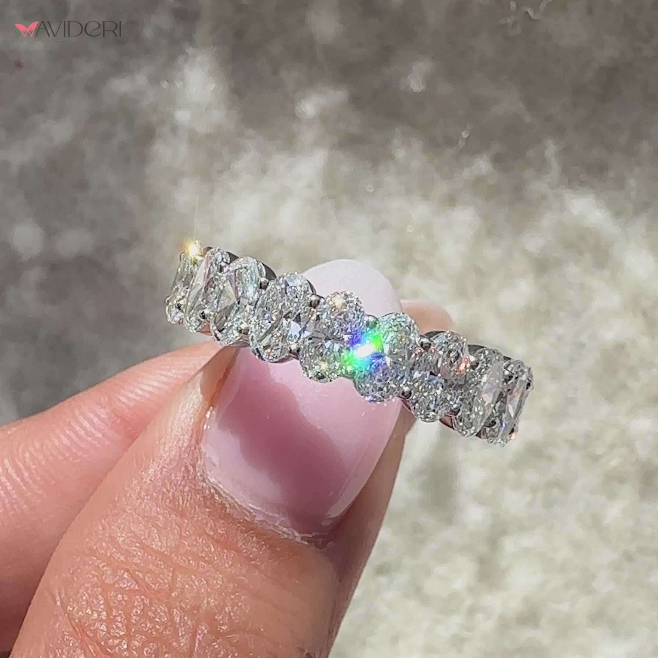 Oval eternity band with shared prongs.