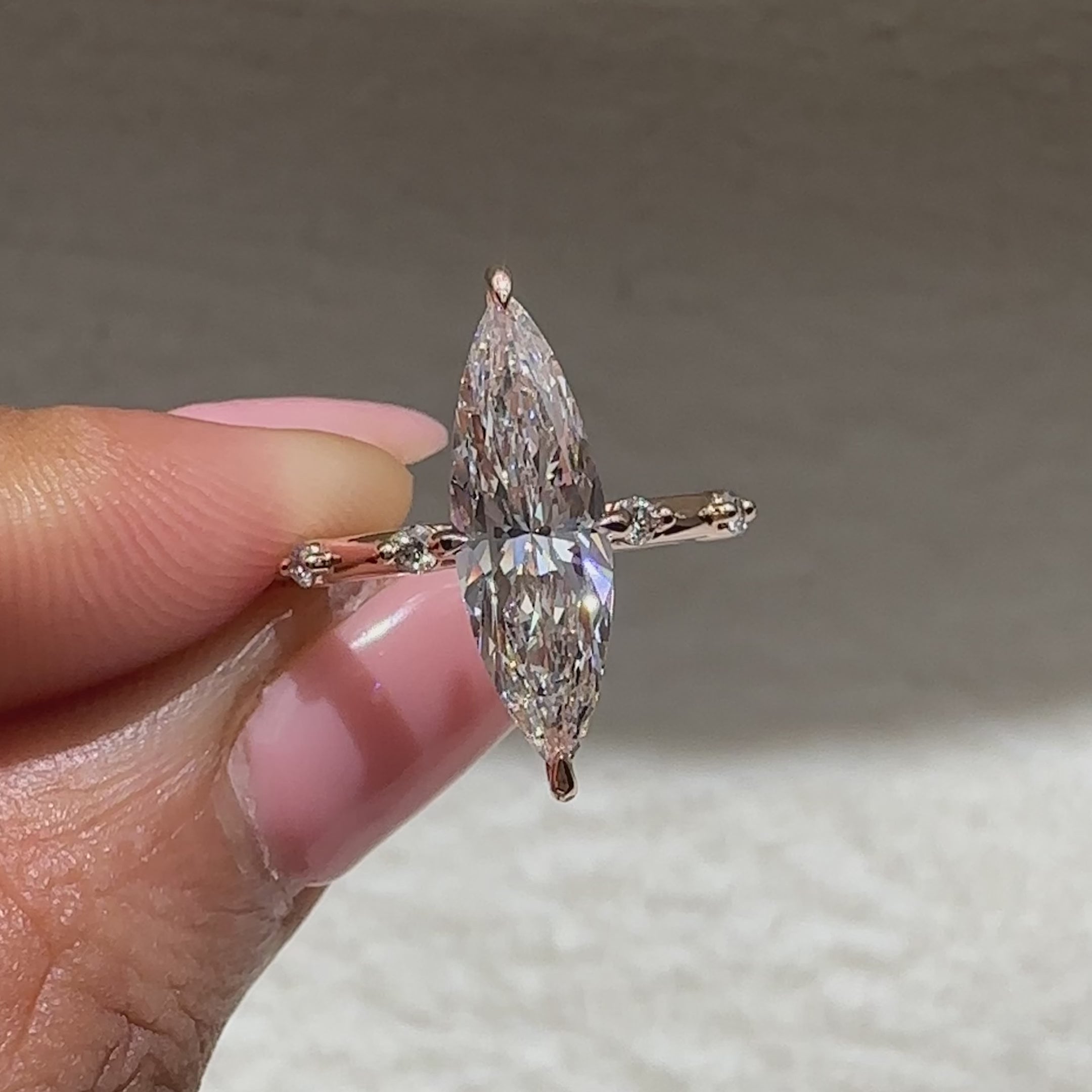Avideri marquise diamond ring with distant pave style accents
