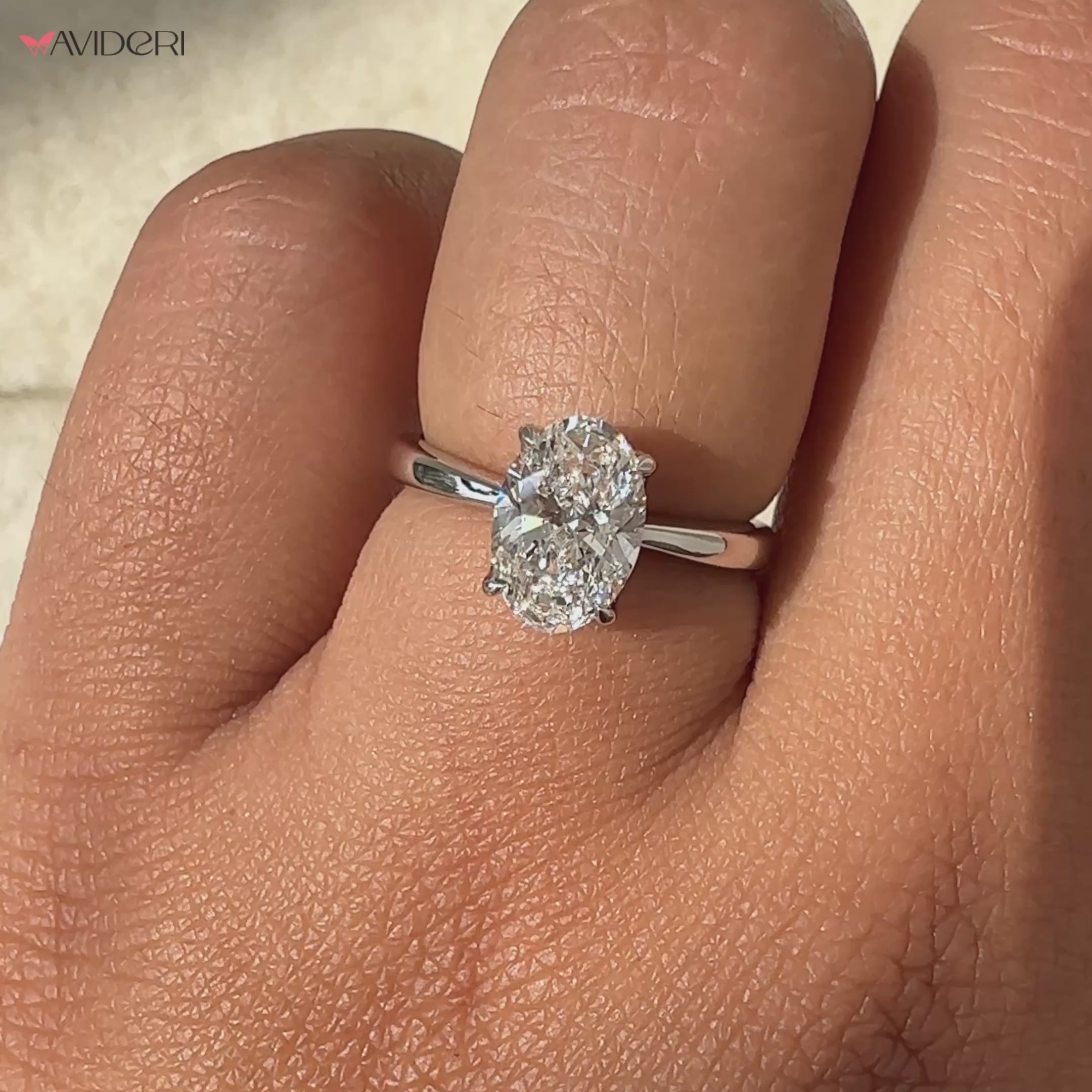 Oval engagement ring with a hidden halo for added sparkle and elegance.
