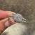 Elegant cushion cut diamond halo cathedral ring.
