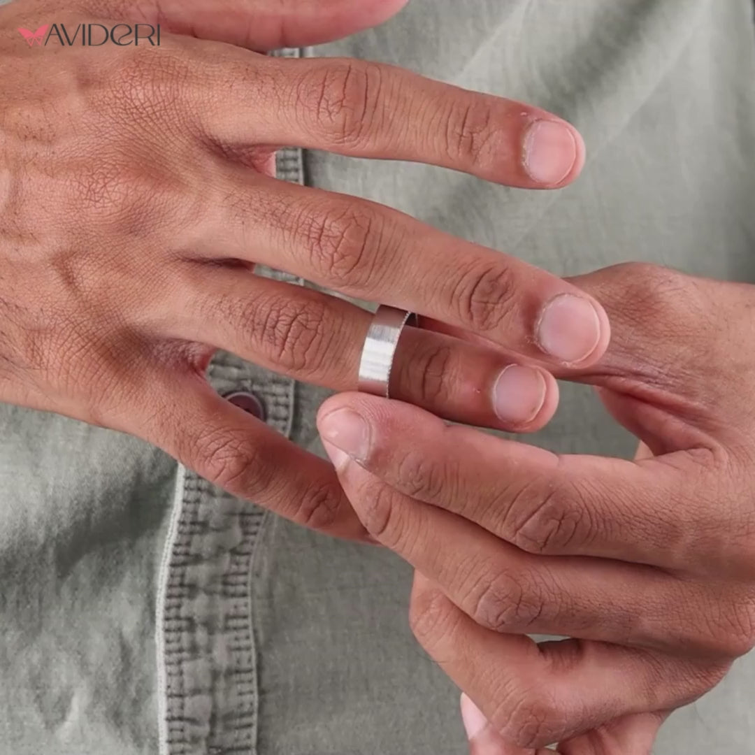 White gold diamond wedding band featuring round diamonds for a classic look.
