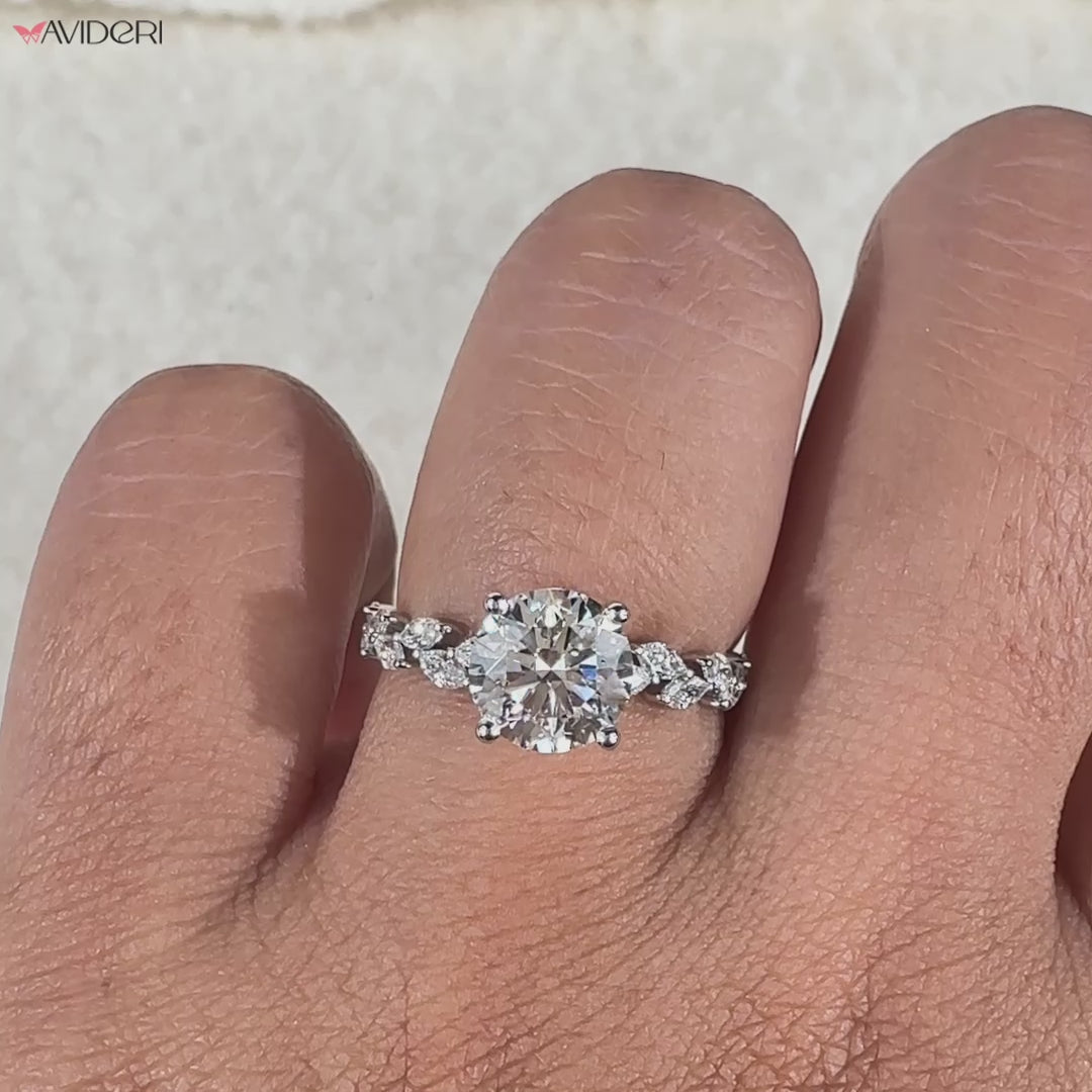 Avideri engagement ring featuring a round and marquise diamond combination, set in a four prong setting.