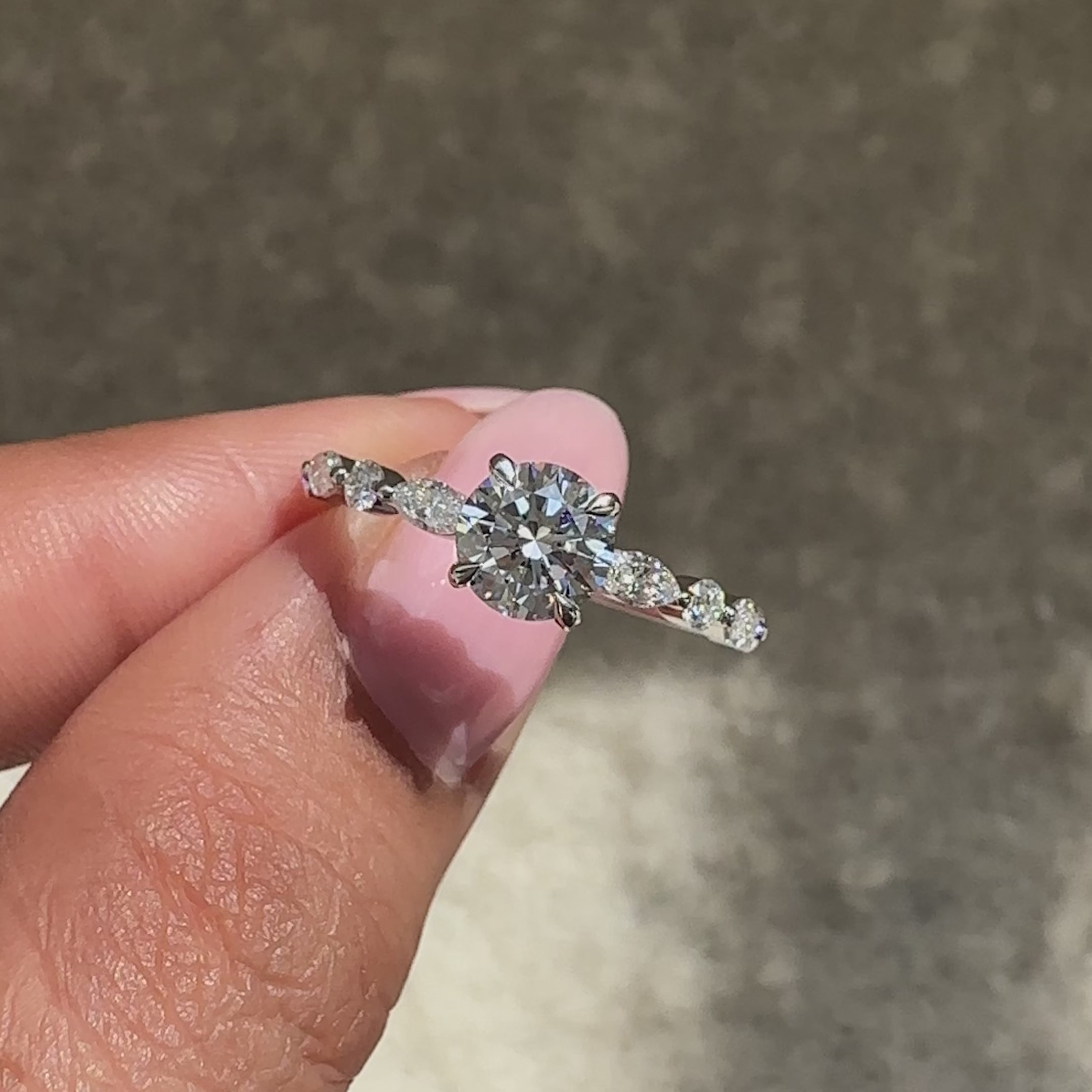 Round diamond ring with modern bubble prong setting.