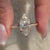 Custom engagement ring made with lab grown marquise diamond and handmade finish.
