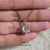 Princess cut diamond pendant in solitaire pendant.