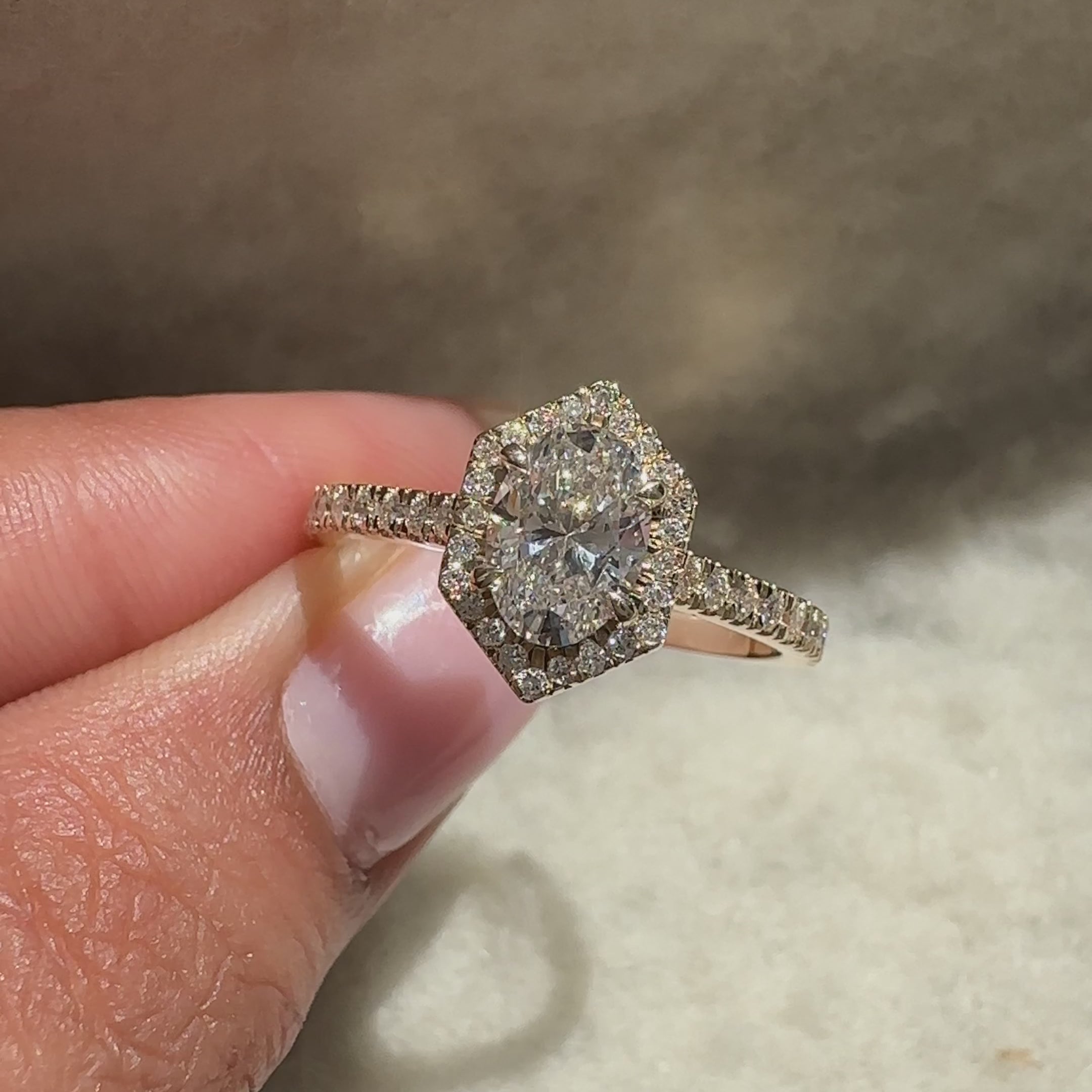 Oval ring with pave and halo round diamonds.
