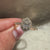 Oval ring with pave and halo round diamonds.
