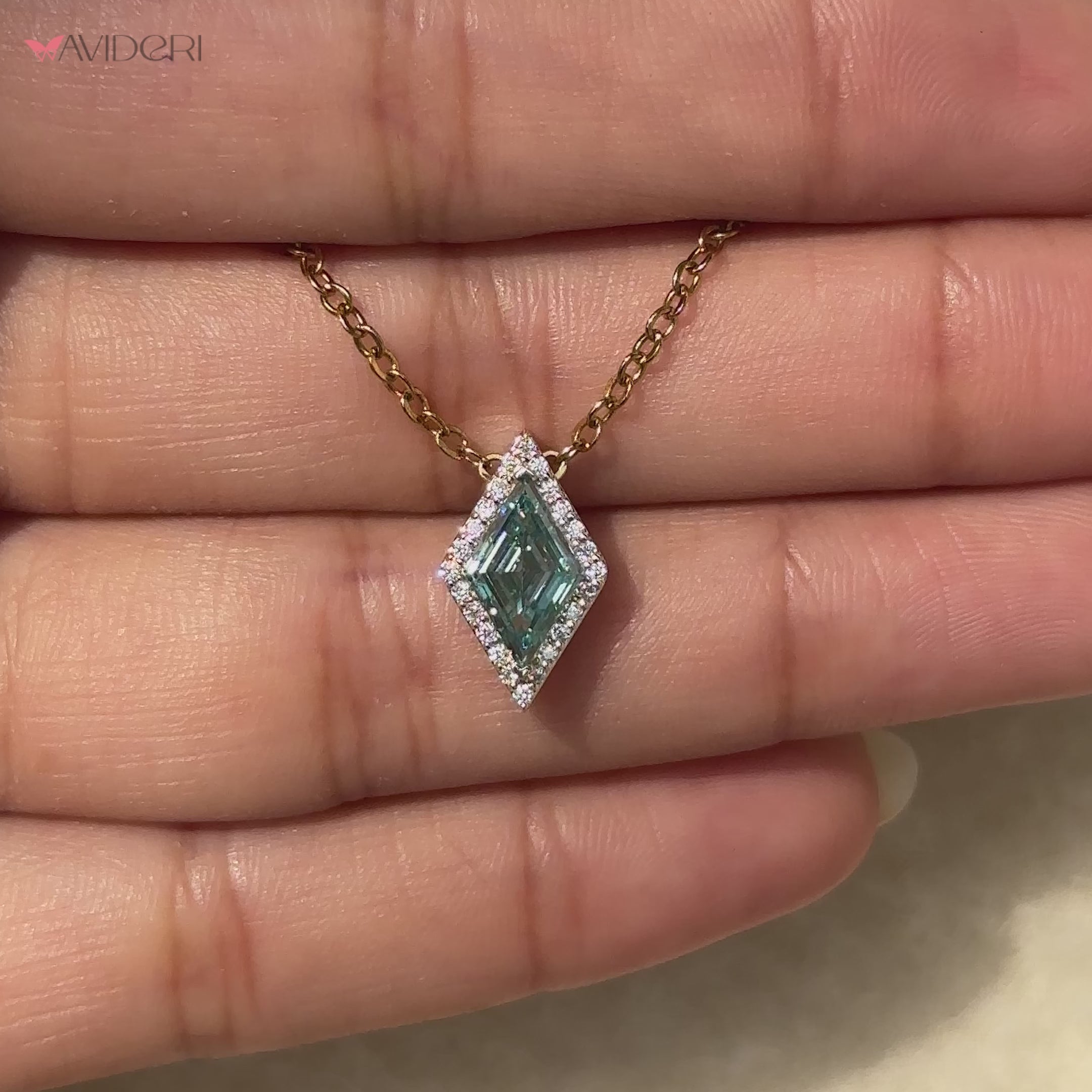 Delicate lozenge moissanite pendant design.
