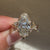 Nature inspired marquise ring with twisted pave.
