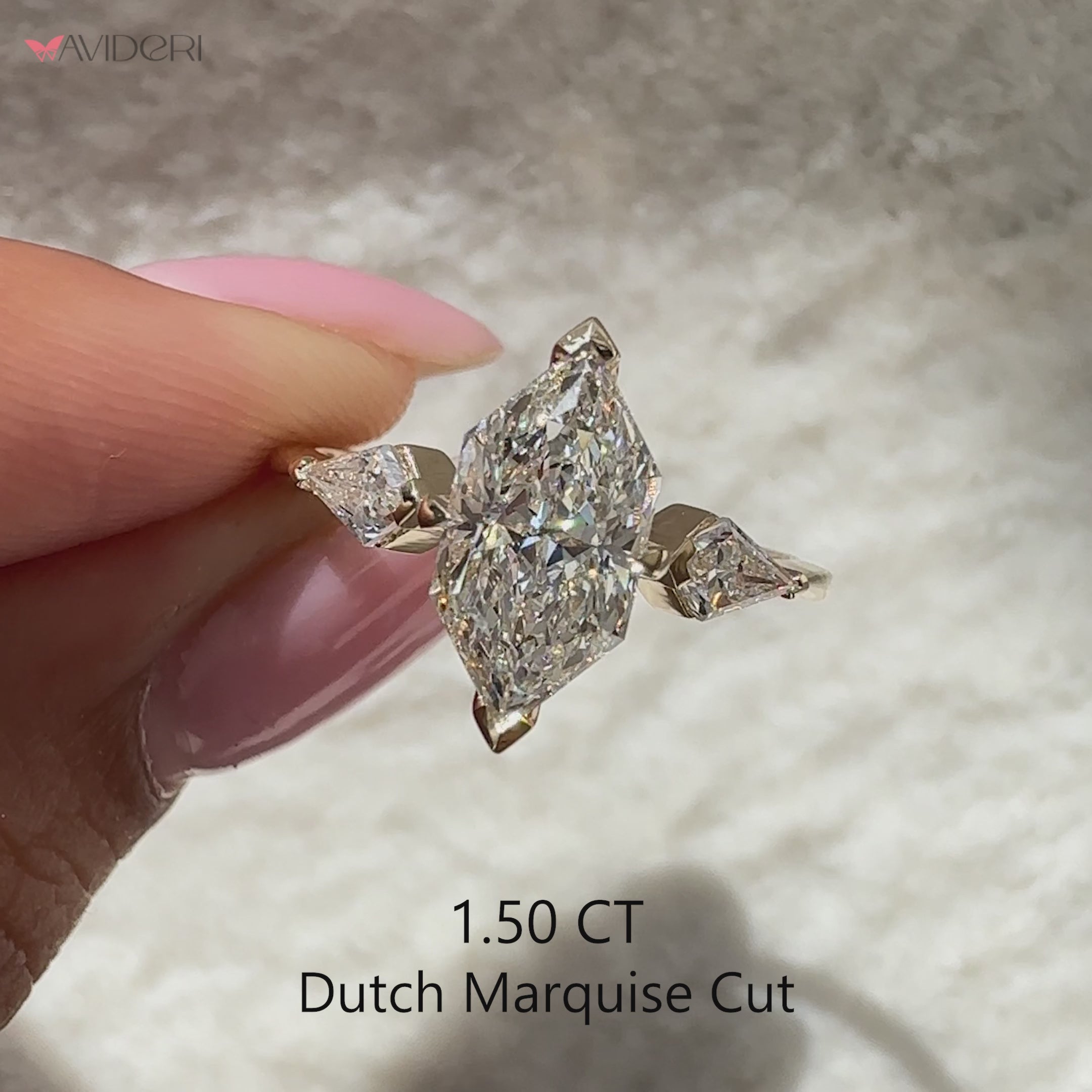 Three stone diamond ring with modern v prong setting.
