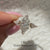 Three stone diamond ring with modern v prong setting.
