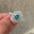 Avideri ring featuring a round moissanite gem.