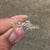 Lab grown round diamond engagement ring with cluster setting.