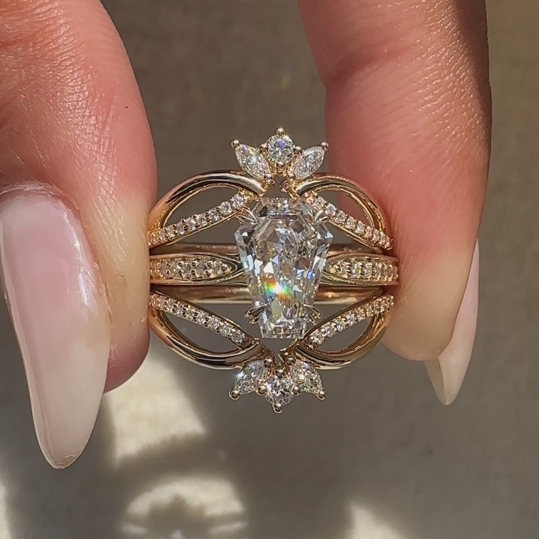 Coffin cut diamond ring with a semi eternity band.
