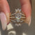 Coffin cut diamond ring with a semi eternity band.
