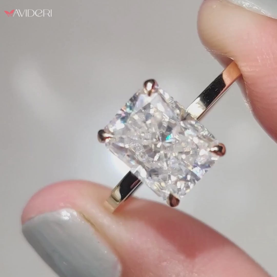 Moissanite radiant cut ring with a stunning, modern design.

