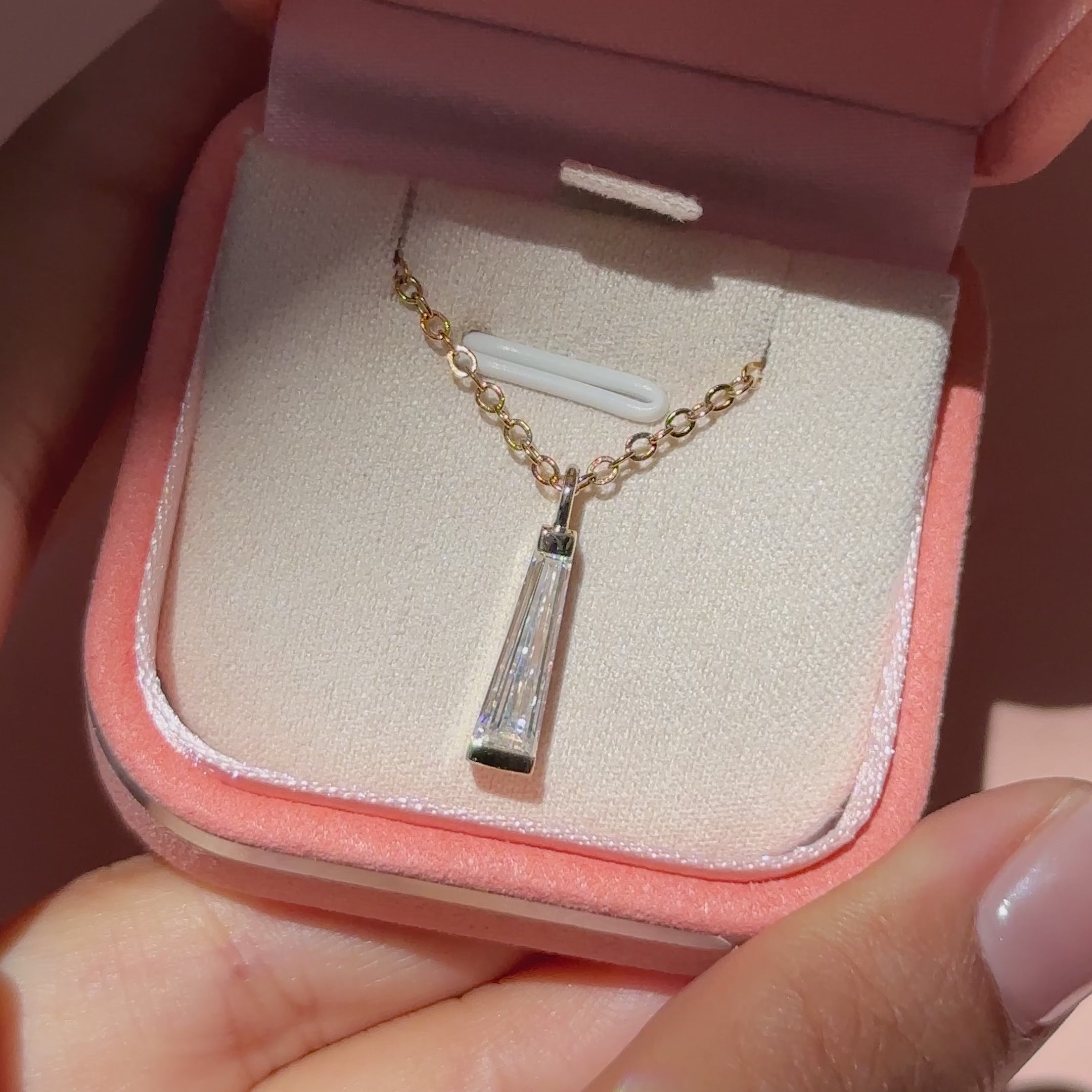 Solitaire moissanite pendant with handmade baguette accent design.
