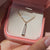 Solitaire moissanite pendant with handmade baguette accent design.
