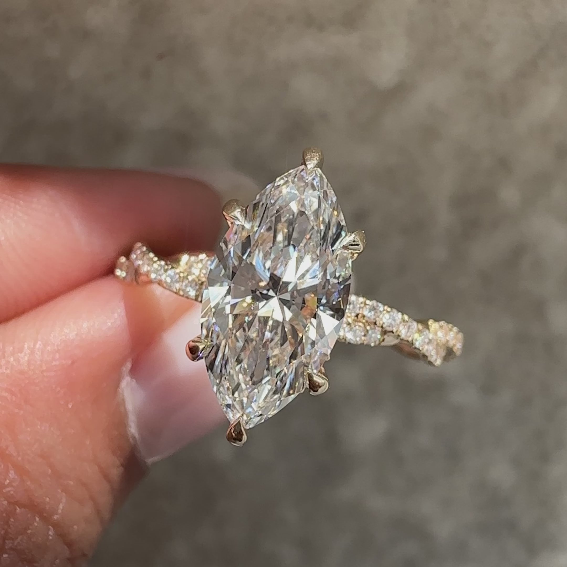 Marquise cut diamond ring with modern twisted band.
