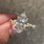 Marquise cut diamond ring with modern twisted band.
