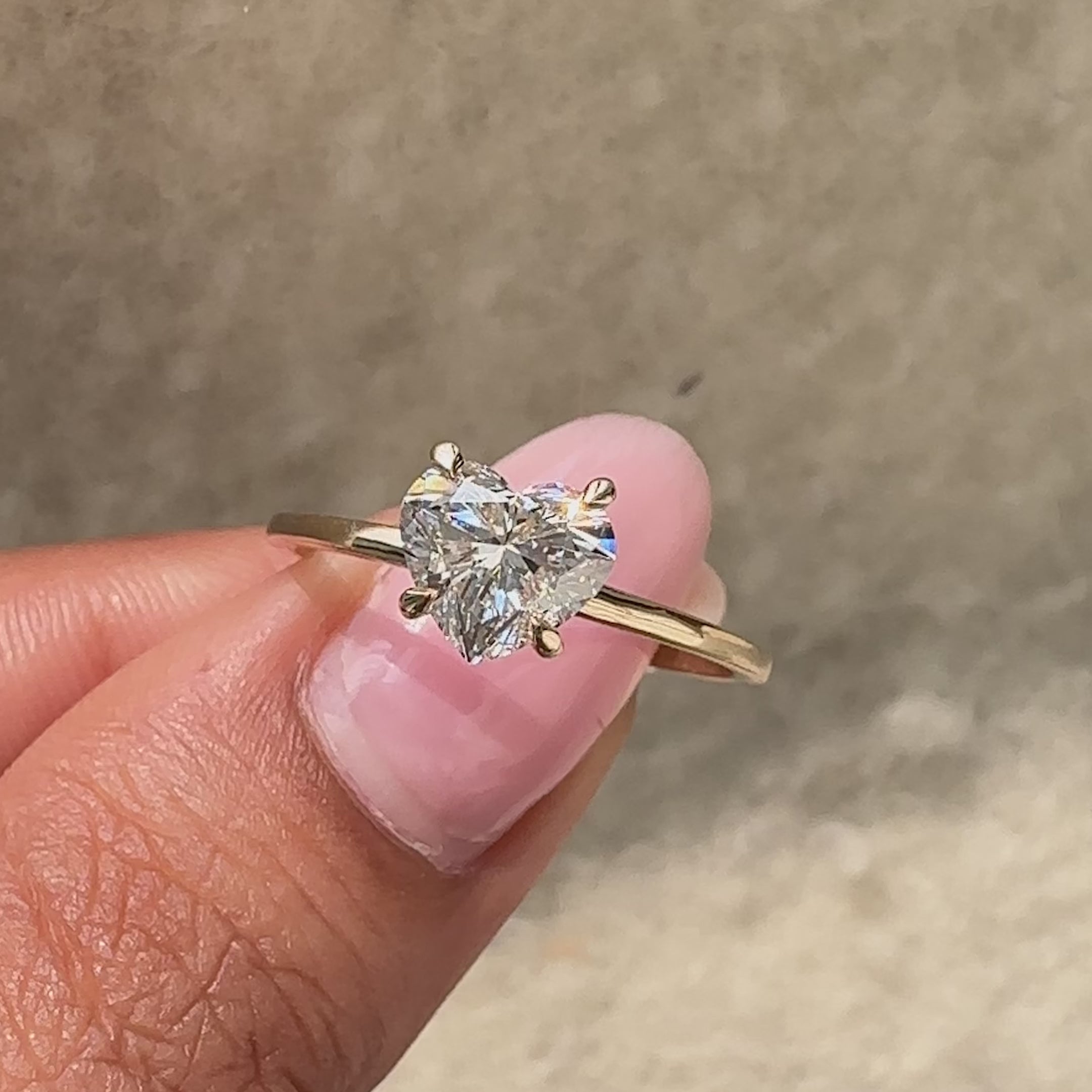 Handmade heart cut diamond ring with delicate craftsmanship.

