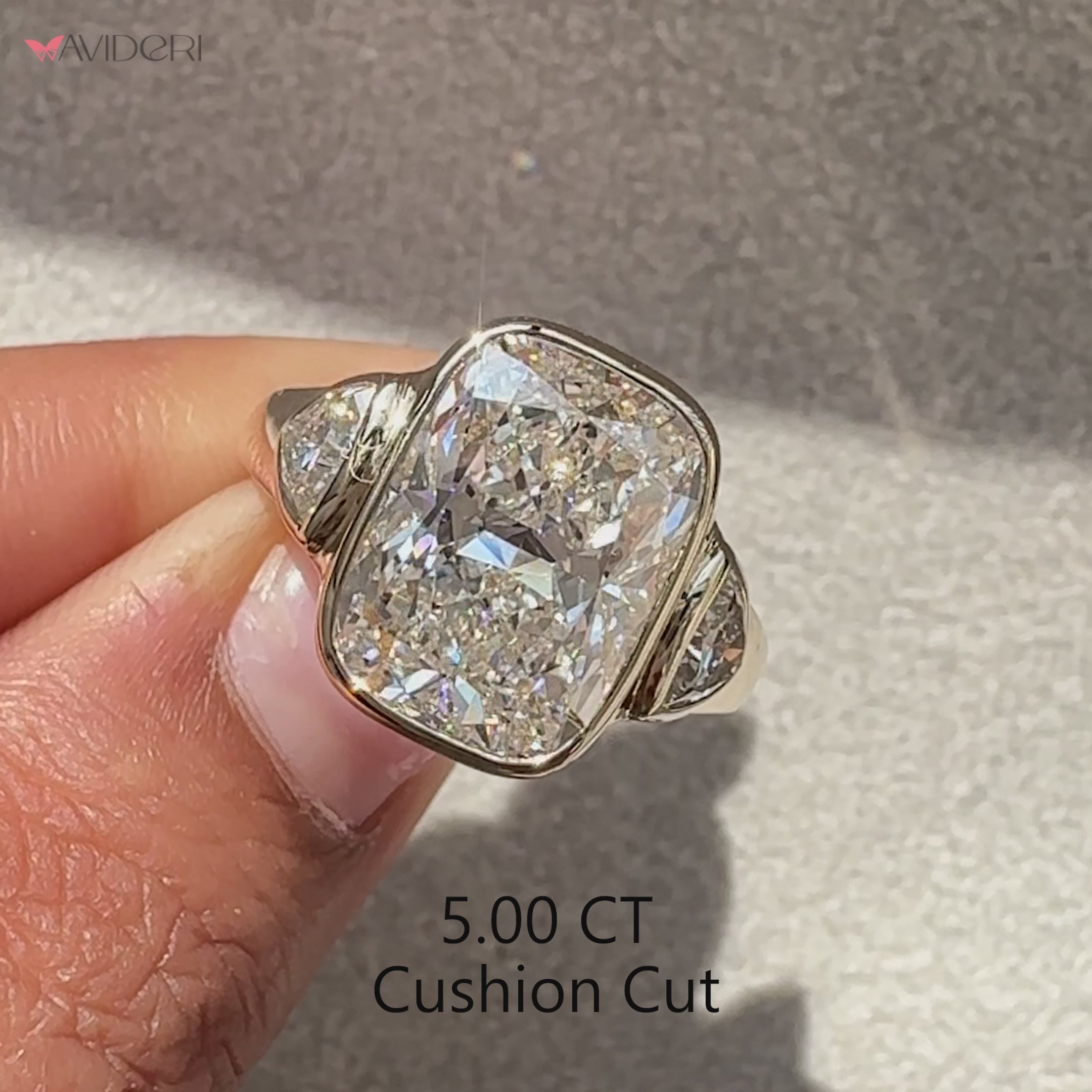 Lab grown cushion cut diamond ring with cathedral setting.
