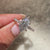 Dutch marquise ring with round diamond accents.