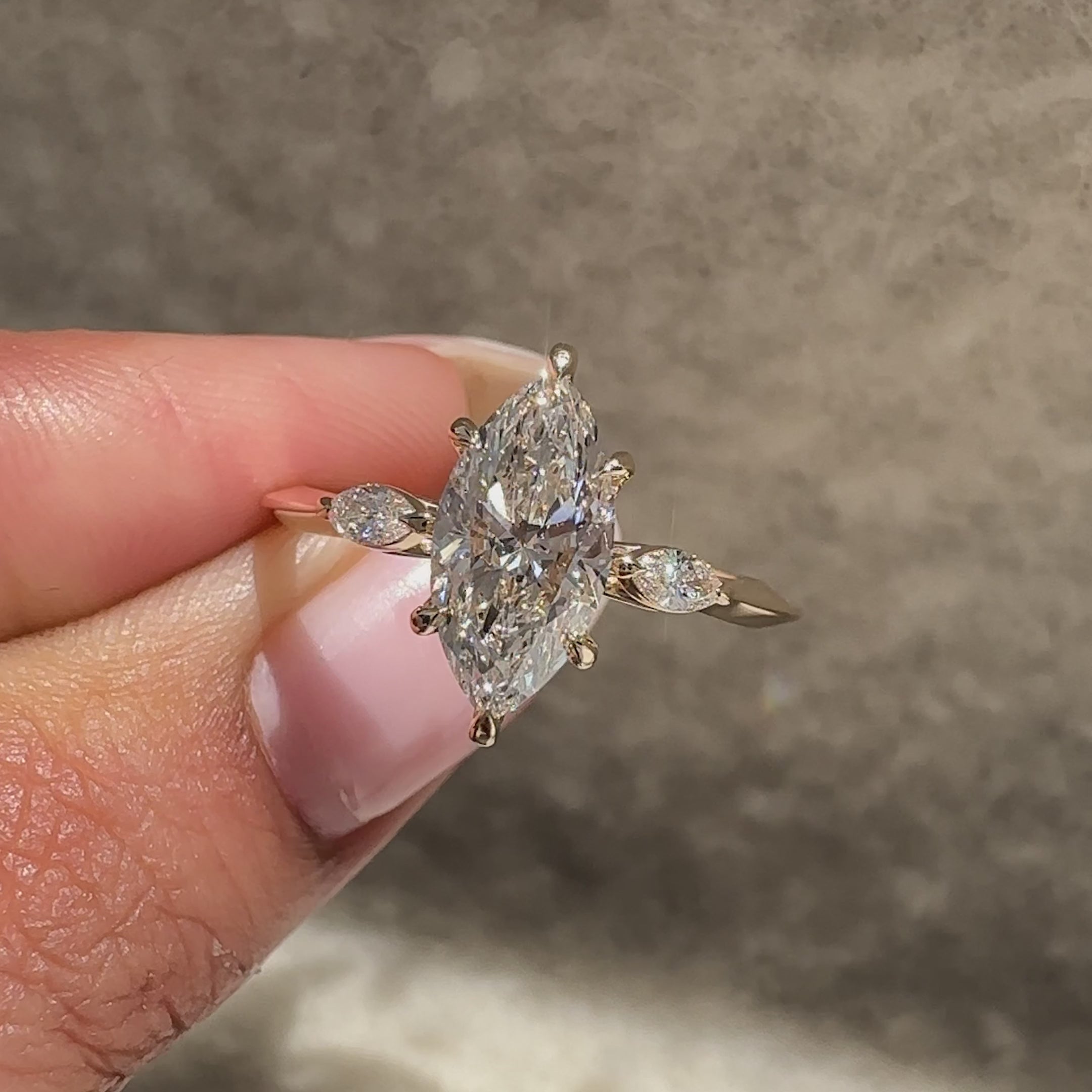 Knife edge shank marquise diamond ring design.
