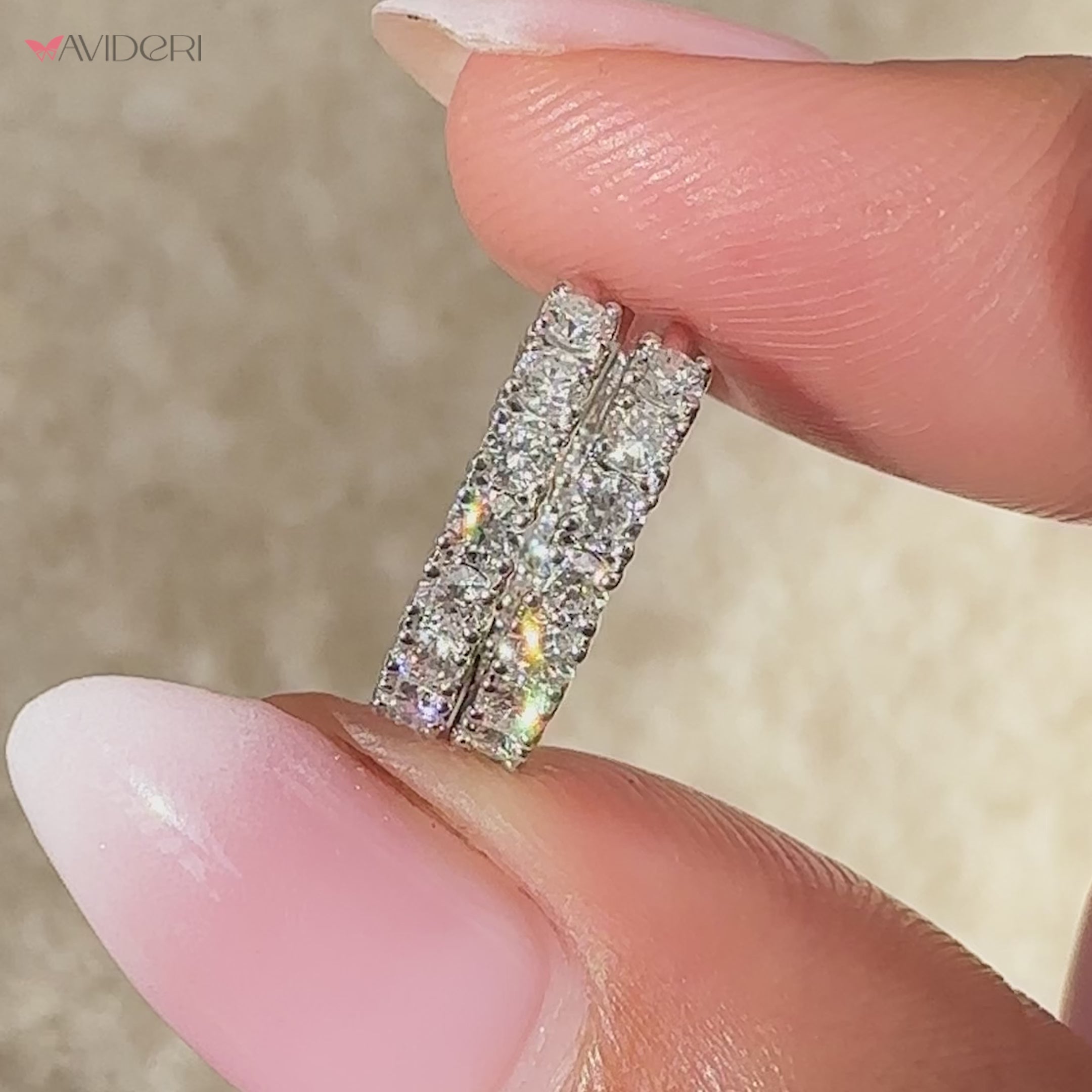 White gold earrings with round diamond pave design.
