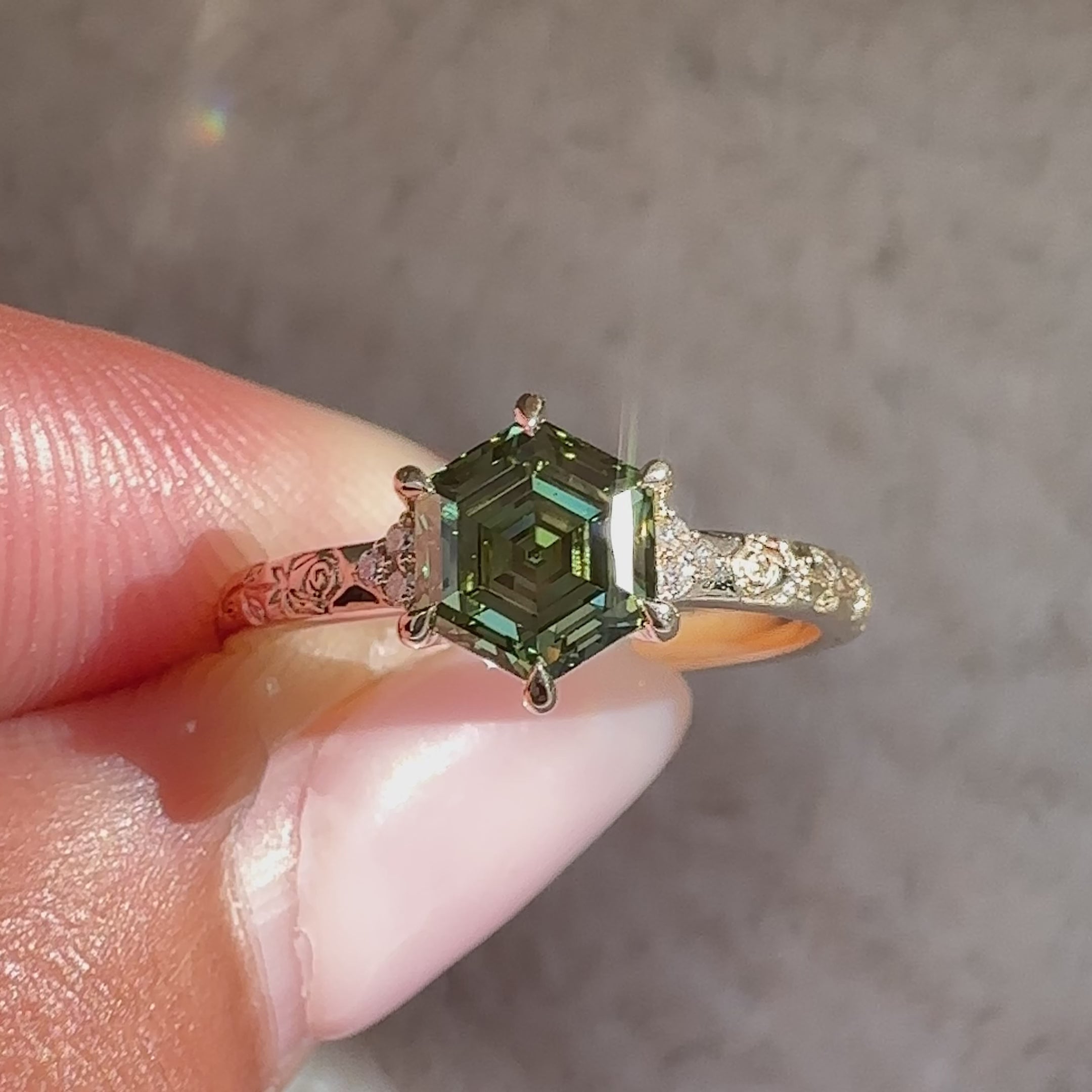 Hexagon diamond ring with rose design engraving.
