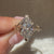 Handmade marquise solitaire ring with leaf prongs.