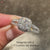 Elegant cushion cut diamond halo cathedral ring.
