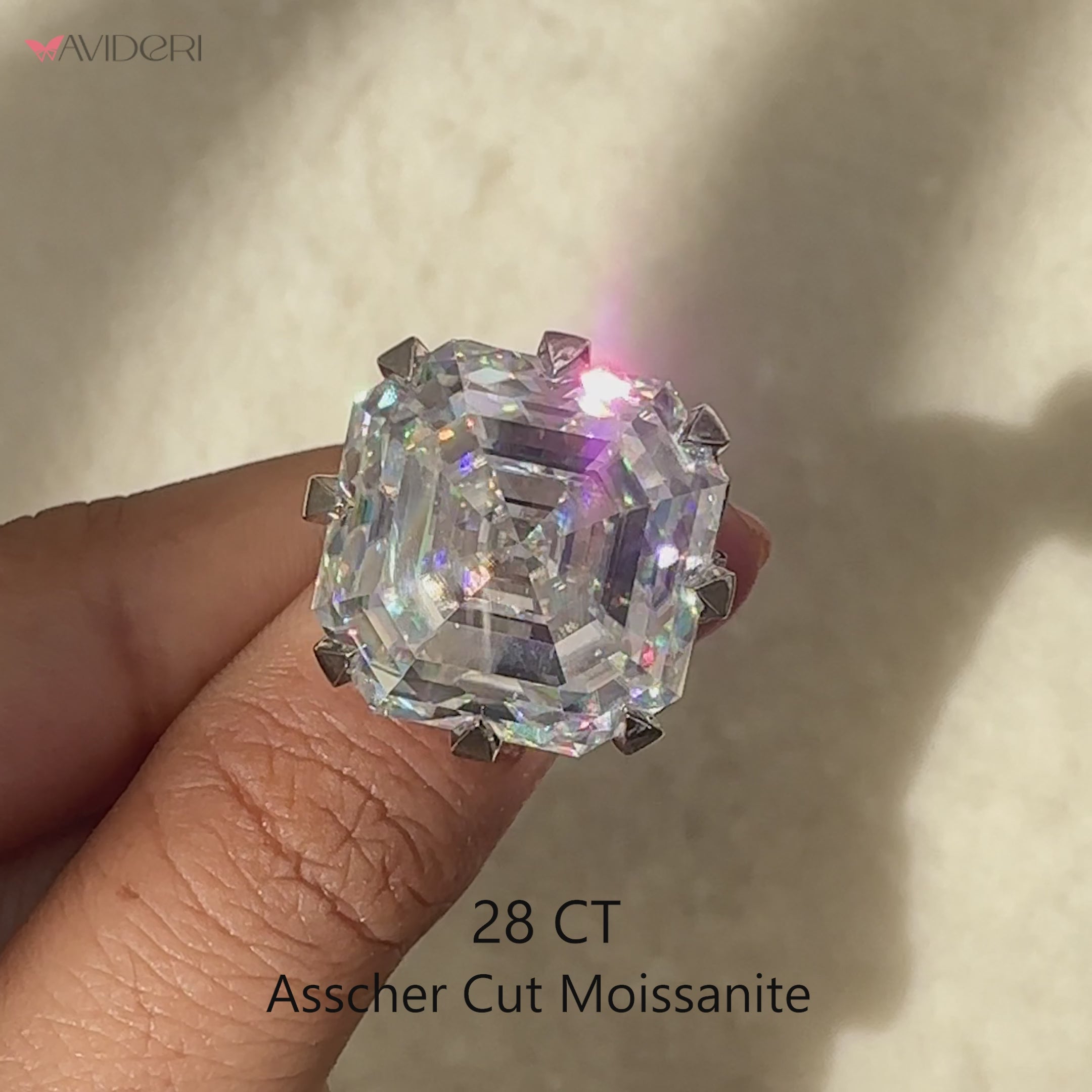 Asscher cut moissanite ring with classic claw setting.