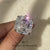 Asscher cut moissanite ring with classic claw setting.
