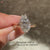 Marquise diamond ring with round stone cluster.