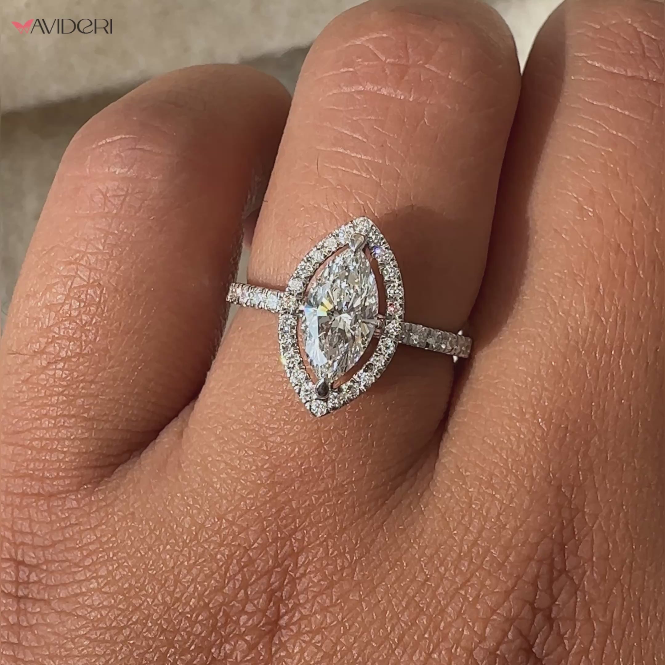 Marquise diamond with halo set in a pave band engagement ring, showcasing unmatched sparkle and sophistication.
