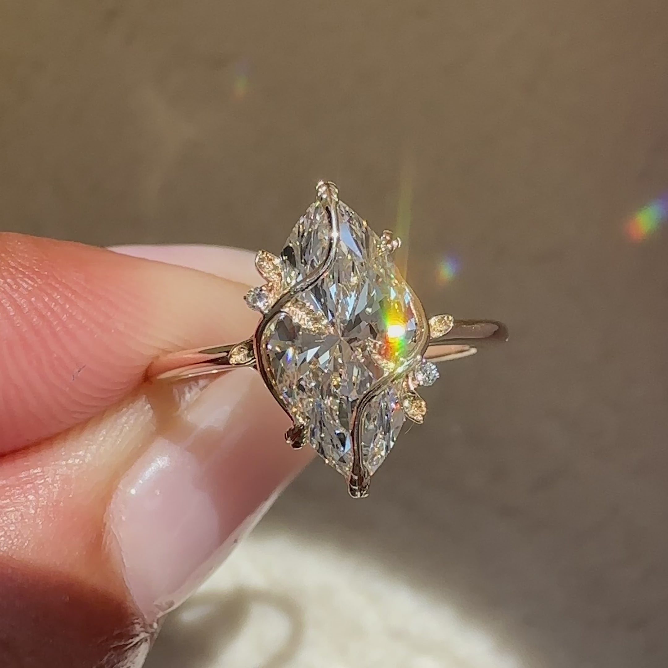 Lab grown marquise ring with round diamond accents.
