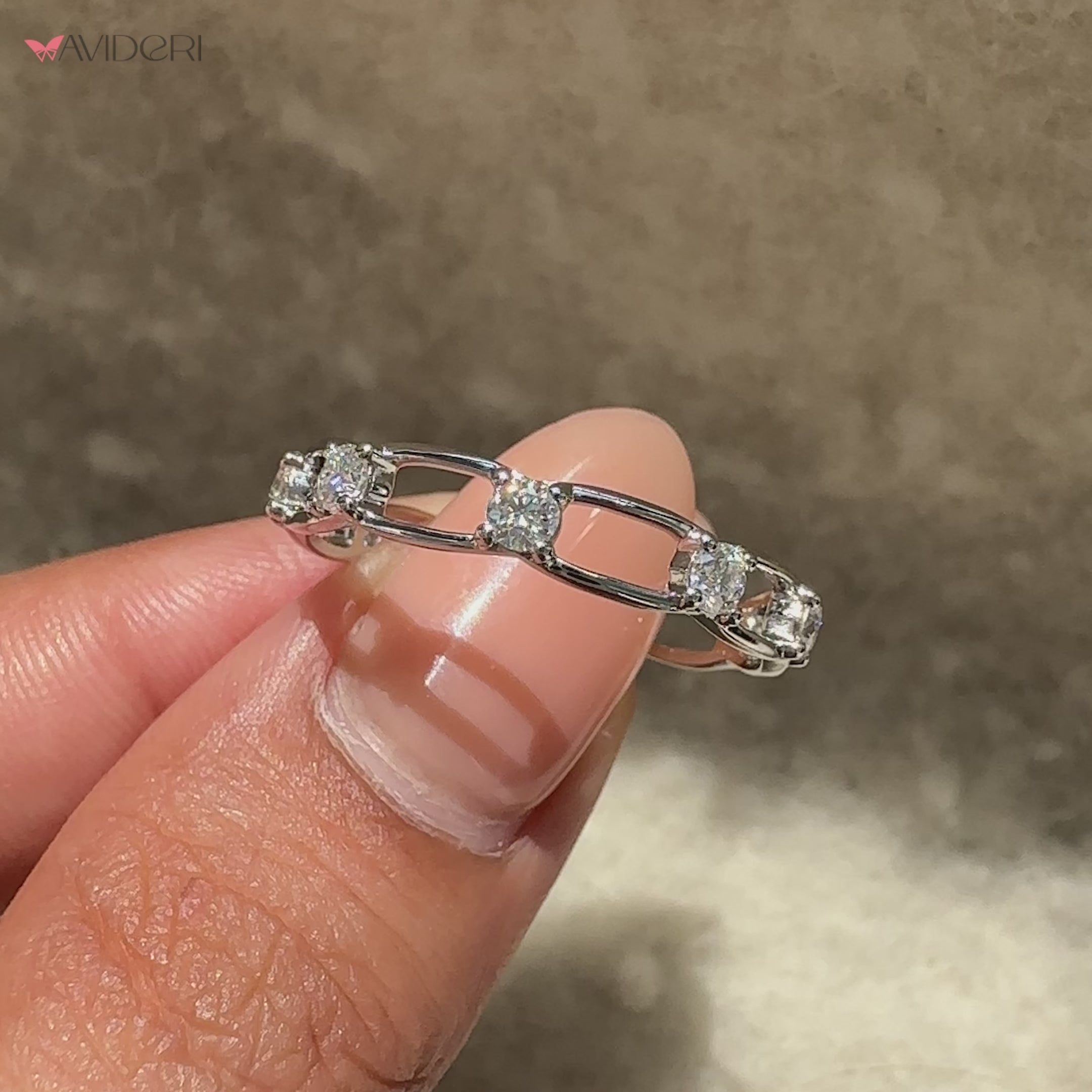 Round moissanite distance pave eternity ring.
