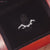 Curvy wedding band featuring smooth, flowing lines.
