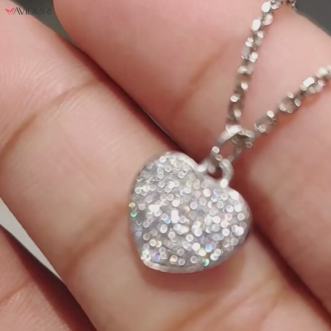 Handmade jewelry with a heart shape pendant and round moissanite stone.
