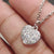 Handmade jewelry with a heart shape pendant and round moissanite stone.
