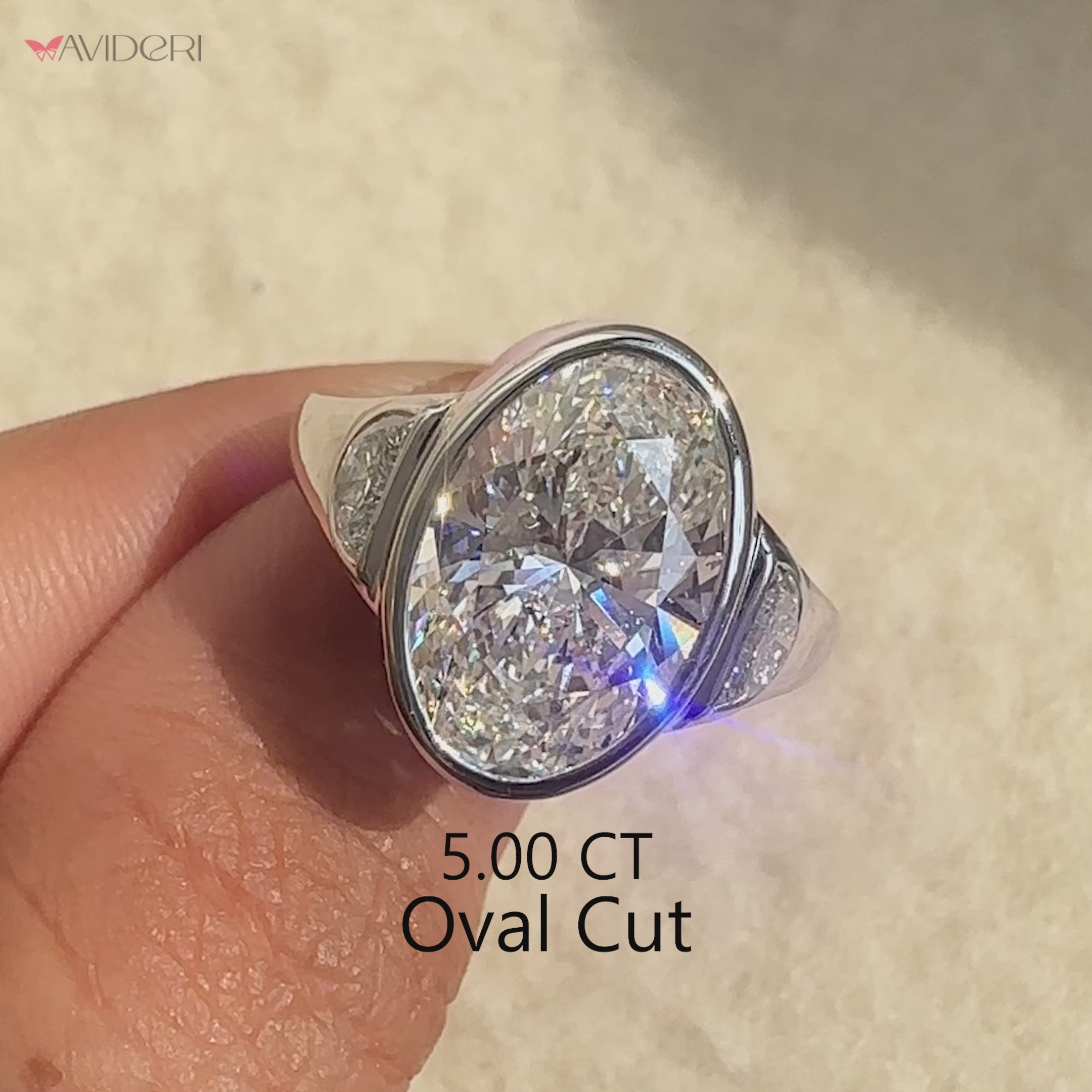 Three stone engagement ring featuring oval lab grown diamond.