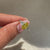 Oval cut yellow diamond ring with marquise and round side stones.